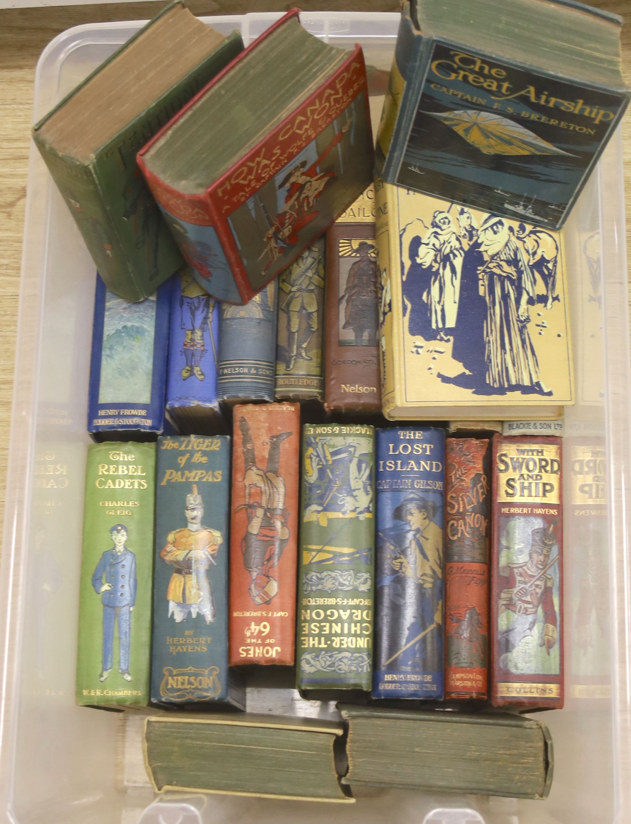 Twenty one early 20th century children's adventure novels, with pictorial covers, published by Blackie and Son Ltd, etc.